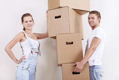 Moving team handling furniture in a Preston property with access considerations