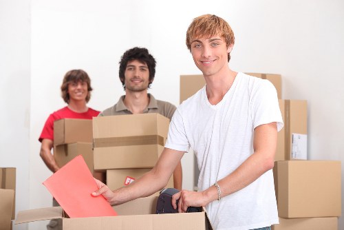 Loading a moving van in Preston with packed boxes and furniture